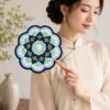blue green floral round fan lifestyle scene