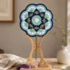blue green floral round fan top view