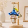 blue hat cat bag charm top view
