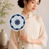 blue white porcelain round fan lifestyle scene