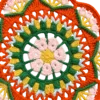 orange green floral round fan close up detail