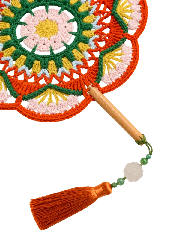 orange green floral round fan detail view