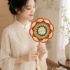 orange green floral round fan lifestyle scene