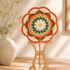 orange green floral round fan top view