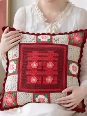 double happiness crochet cushion hand held close up