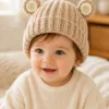oat bear ear bonnet hanging display