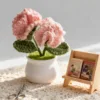 pink carnation white pot ornament angled view
